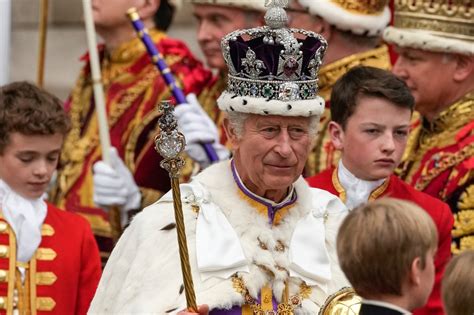 King Charles III crowned with regal pomp, cheers and shrugs